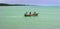 Fishermen at work on the wooden motor boat.