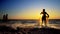 Fishermen working repairing fishing nets on ocean coast at sunset