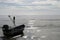 Fishermens boat at seacoast,Fishing boat on beach in morning. Tr