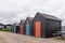 Fishermens shacks  lined up with doors in bright colours