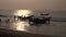 Fishermens silhouette and boats in Bengal sea, Tamilnadu,India