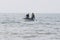 Fishers check fishing nets on sea in a boat in Nam Tien, Vietnam