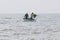 Fishers check fishing nets on sea in a boat in Nam Tien, Vietnam