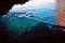 The fishes shoal in clear water of a grotto in Palaiokastritsa, Ð¡orfu, Greece