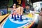 Fisheye shot of young men and women playing board game ludo at a cafe