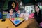 Fisheye shot of young men and women playing board game ludo at a cafe