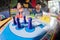 Fisheye shot of young men and women playing board game ludo at a cafe