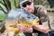 Fishing adventures, carp fishing. Mirror carp, angler with a big fishing trophy