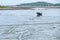 Fishing boat aground at the fishing pier at low tide