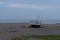 Fishing boat on Aldeburgh shingle beach at sunset