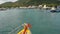 Fishing boat with amulets entering port. Bright boat with thai religious amulets floating towards harbor of diving