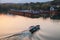 Fishing boat with boatman goes on the West Lake