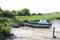 Fishing boat in the breakthrough of Carmet during the low tide