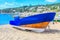 Fishing boat covered with a blanket on the beach