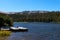 Fishing boat docked in a calm lake of dreamy scenery