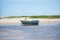 Fishing boat docked in the sand of Guaibim beach in the tourist town of Valenca, Bahia