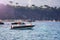 Fishing boat floating on the water, blue sea and sky with copyspace