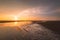 Fishing boat on a golden sunset Taiwan west coast with wind turbines