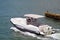 Fishing Boat With Grey Canvas Canopy and Two Outboard Engines