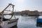 Fishing boat in the harbor next to the old town of Gallipoli, Apulia, Italy