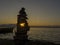 fishing boat on the lake, zen stones and serenity, simplicity and peace at sunset