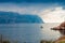 Fishing boat leaves in the sea, the sea and mountains landscape