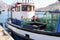 Fishing boat with lobster traps moored in the port in Hout Bay harbor, Cape Town