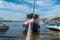 Fishing boat moored at the edge of the Ribeira waterfront in Salvador, Brazil