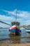 Fishing boat moored at the edge of the Ribeira waterfront in Salvador, Brazil