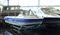 Fishing boat. Motor boat for sale in the store. Located on a wheeled cart