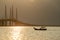 A fishing boat move toward Penang second Bridge main span.