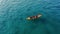 Fishing from a boat in the open ocean, a hobby of catching fish. Beautiful seascape, aerial view. travel banner.