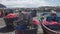 Fishing boat parked near pier, drift nets lying in baskets, small business