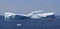 Fishing Boat Passing Big Iceberg