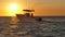 Fishing boat racing out to sea in Mexican waters.