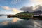 Fishing boat and red village Reflecting the water in the evening at Ballstad, Northern Norway