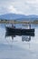 Fishing boat reflected in the water