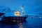 Fishing boat in Reine village at night. Lofoten islands, Norway