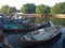 The fishing boat rests next to the riverside house in the evening.  Tangerang Indonesia, July 14 2023.