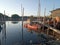 The fishing boat rests next to the riverside house in the evening.  Tangerang Indonesia, July 14 2023.