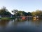 The fishing boat rests next to the riverside house in the evening.  Tangerang Indonesia, July 14 2023.