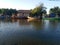 The fishing boat rests next to the riverside house in the evening.  Tangerang Indonesia, July 14 2023.