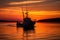 fishing boat silhouette against a vibrant sunset