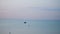Fishing boat steadily cruising along the water far out at sea. 4k video motion 3840x2160