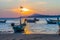 Fishing boat stuck on the mud during sunrise