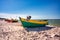 Fishing boat on the sunny Baltic Sea beach in Debki. Poland