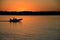 Fishing boat on sunset river