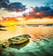 Fishing boat at sunset time. Beautiful landscape.