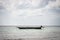 Fishing boat on tranquil seascape. Lonely sailboat at seaside. Aerial Indian ocean with wooden boat. Nautical vessel in the sea.