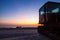 Fishing boat transporter at sunset